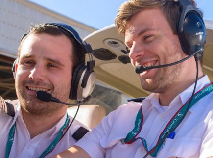 Image of a trainer showing a student a cockpit