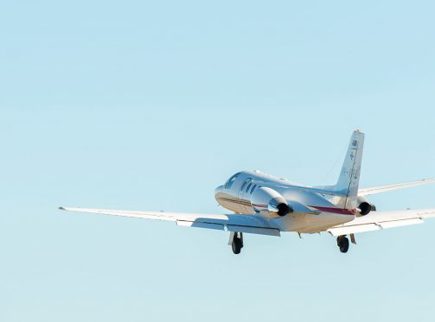 Image of alight aircraft flying through the sky